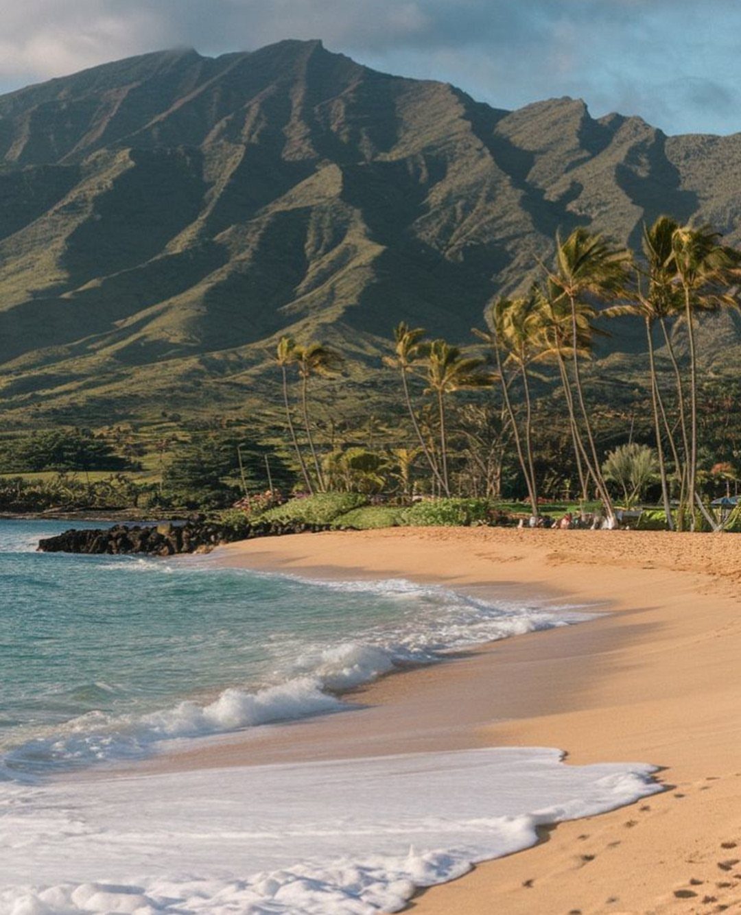 6 Beach Places to Visit, From Cape May to the Kona Coast 6 Sandy beach with turquoise water, palm trees, and large volcanic mountains in background.