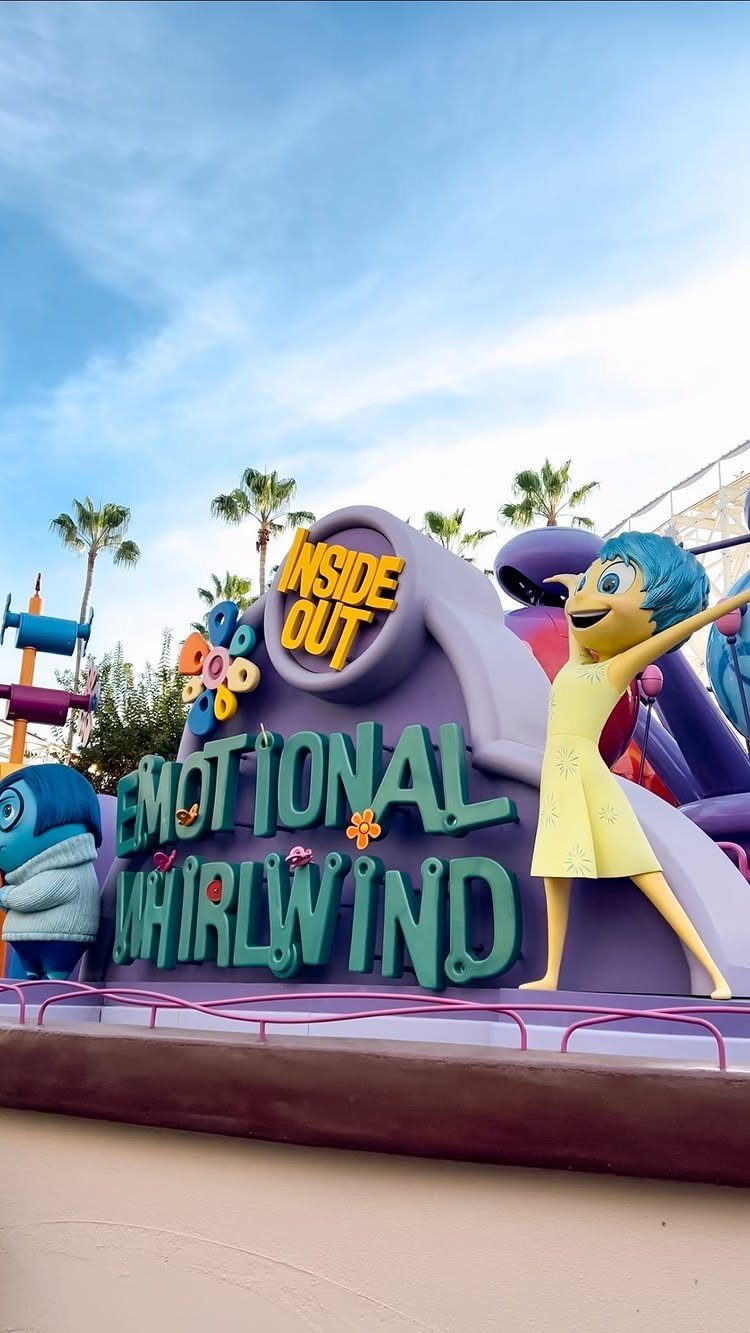 Bucket List Travel Destinations in the USA: 33 Ideas 11 Joy character and Emotional Whirlwind sign at a Disney theme park ride.