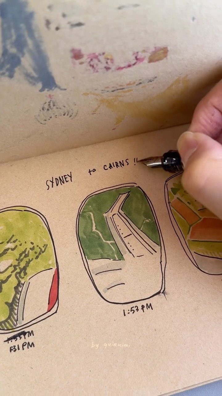 Hand writing in a travel journal with drawings of airplane window views.