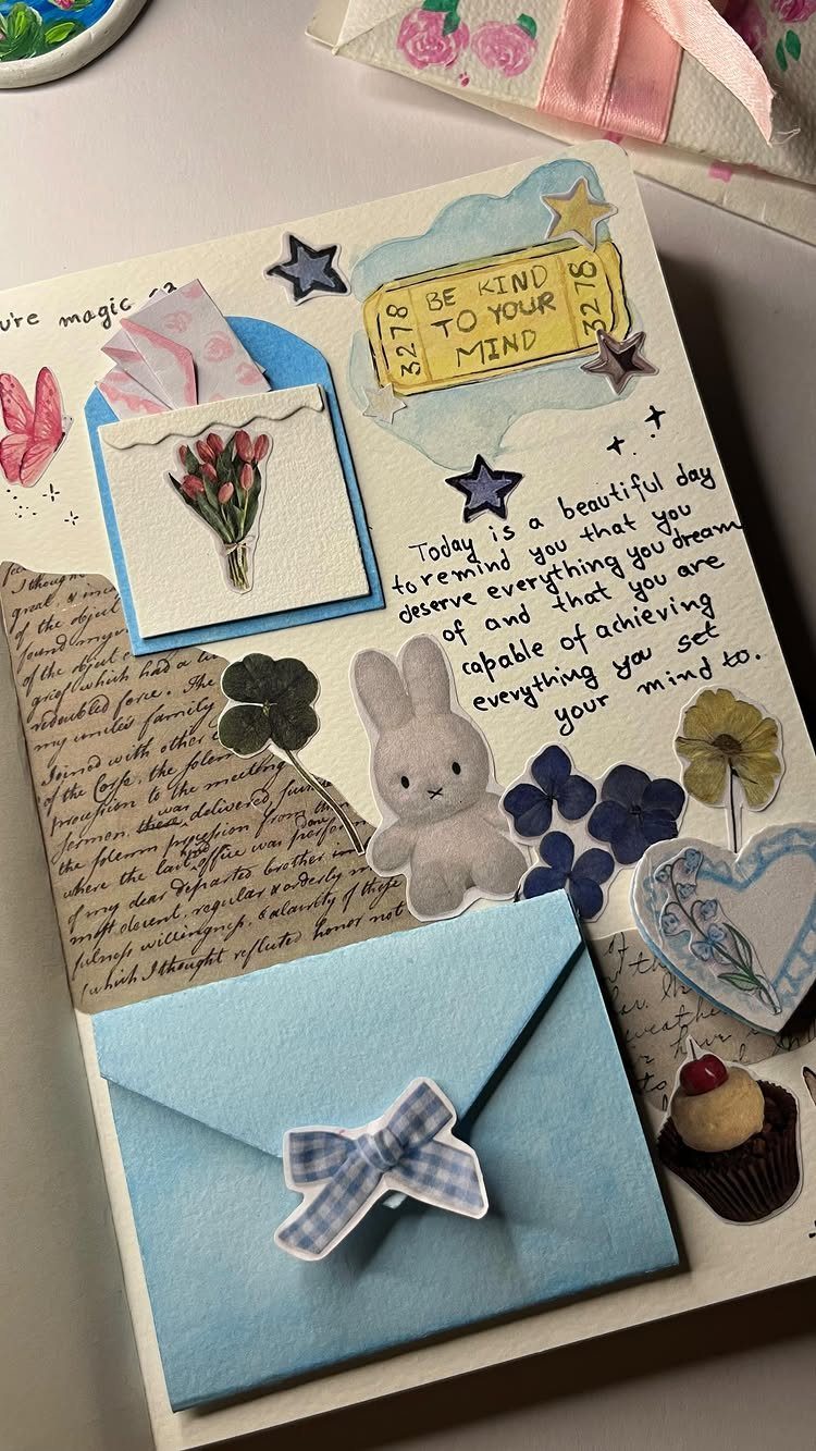 Junk journal page with blue envelopes, stickers, and handwritten positive affirmations.
