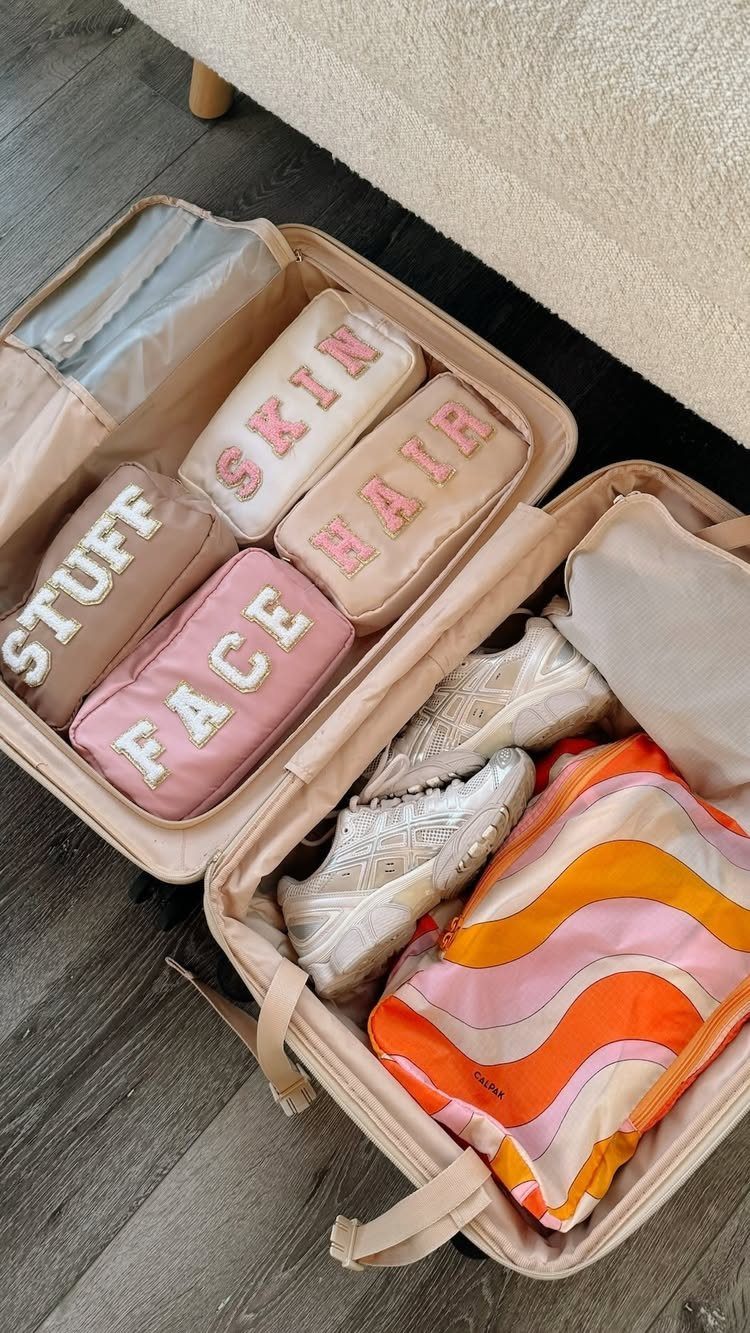 How to Pack for a 3 Week Trip: 7 Packing Ideas 5 Beige suitcase filled with labeled packing cubes, white sneakers, and a colorful bag.