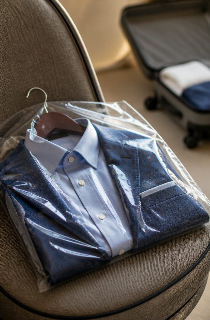 Dry cleaning bags used to protect dress shirts during travel.
