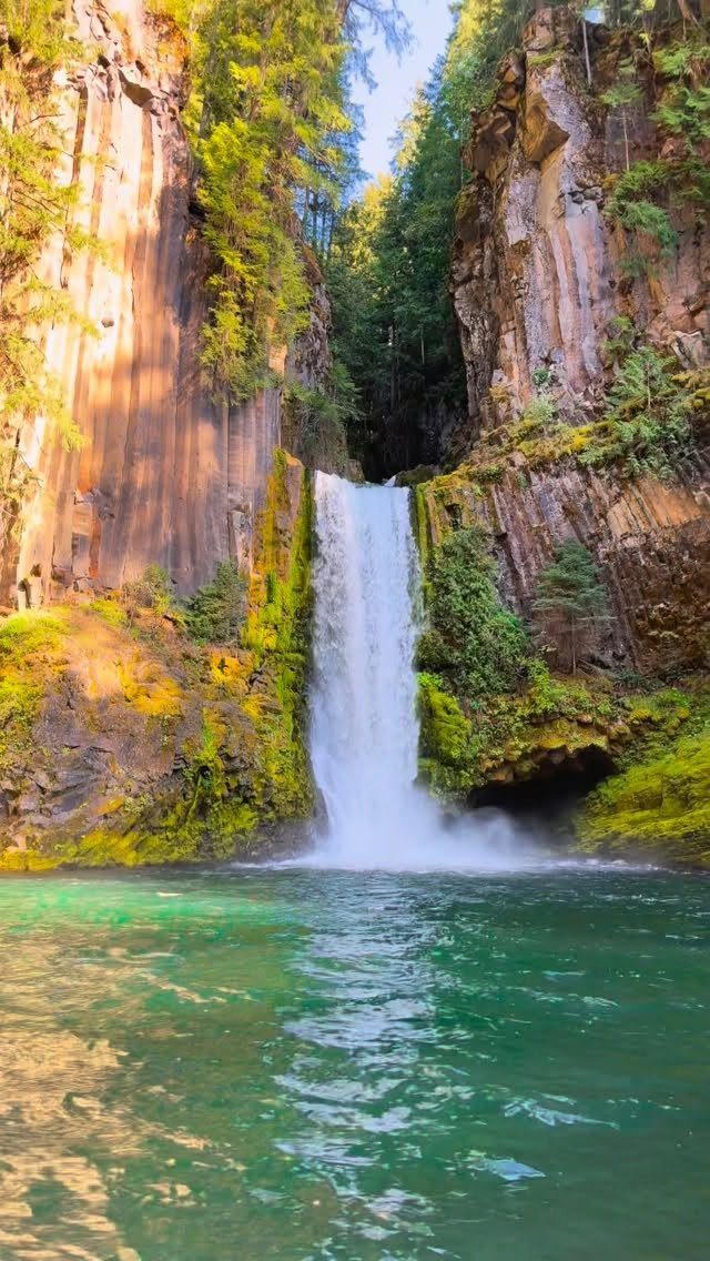 Nature Places to Visit: 19 Parks, Gardens and Overlooks 10 Waterfall cascading between rocky cliffs into a clear turquoise pool of water.