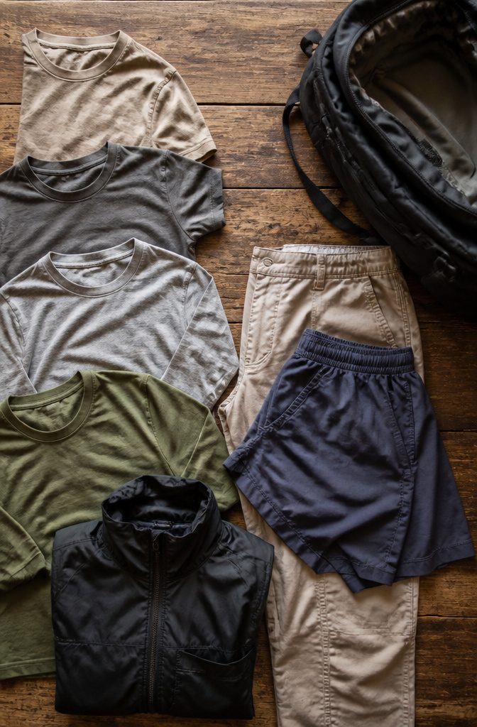 A selection of neutral clothing items suitable for backpacking.