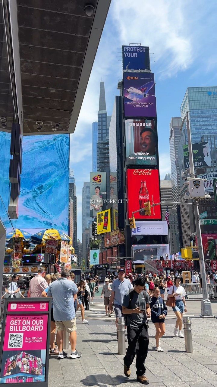 7 Sights to See in the US, From Acadia to Old Idaho 3 Times Square in New York City with tall buildings and bright digital billboards.