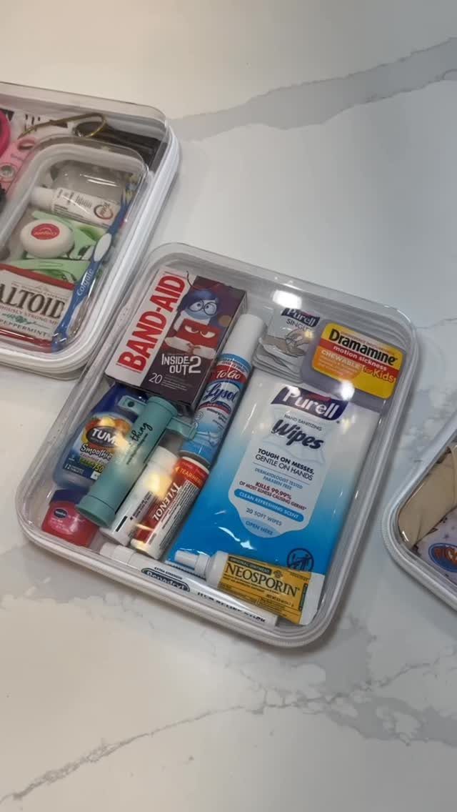 Medical supplies and hygiene products organized inside a clear plastic travel container.
