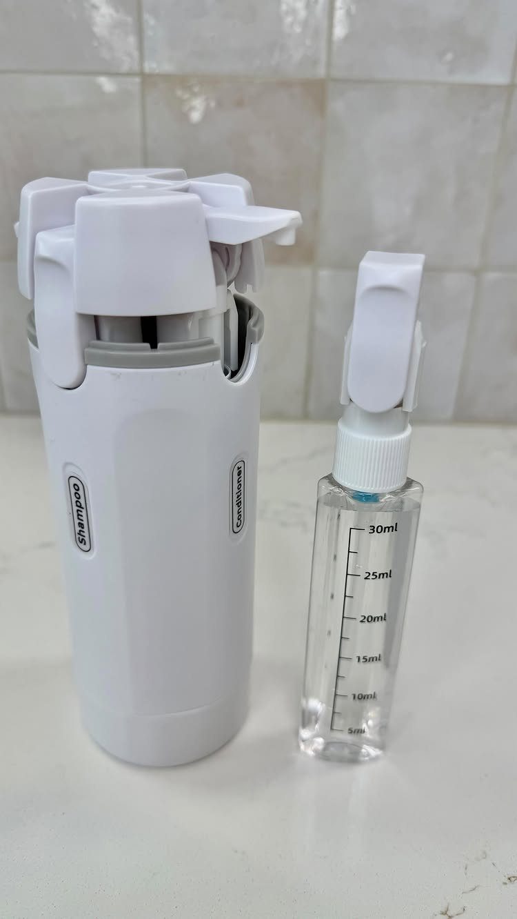 Travel Necessities for Japan: 10 Items Worth Packing 3 Travel-sized toiletries including a multi-chambered white bottle and a small clear spray bottle.