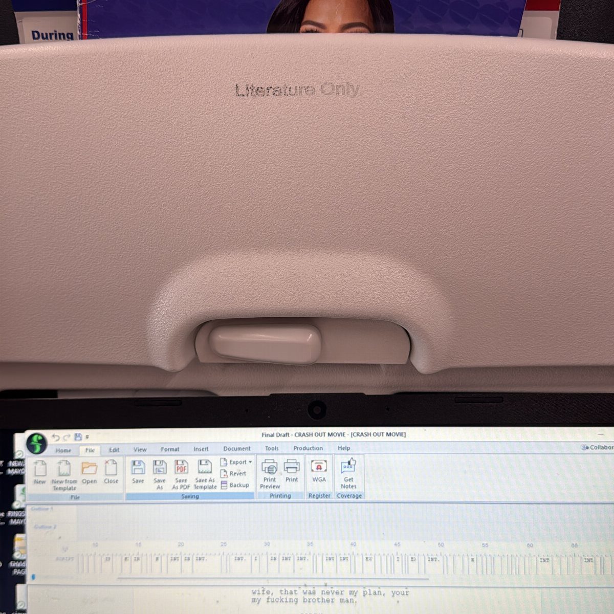 9 Ideas for What to Do on the Plane Besides Scrolling 6 Laptop screen showing a script being written on an airplane tray table